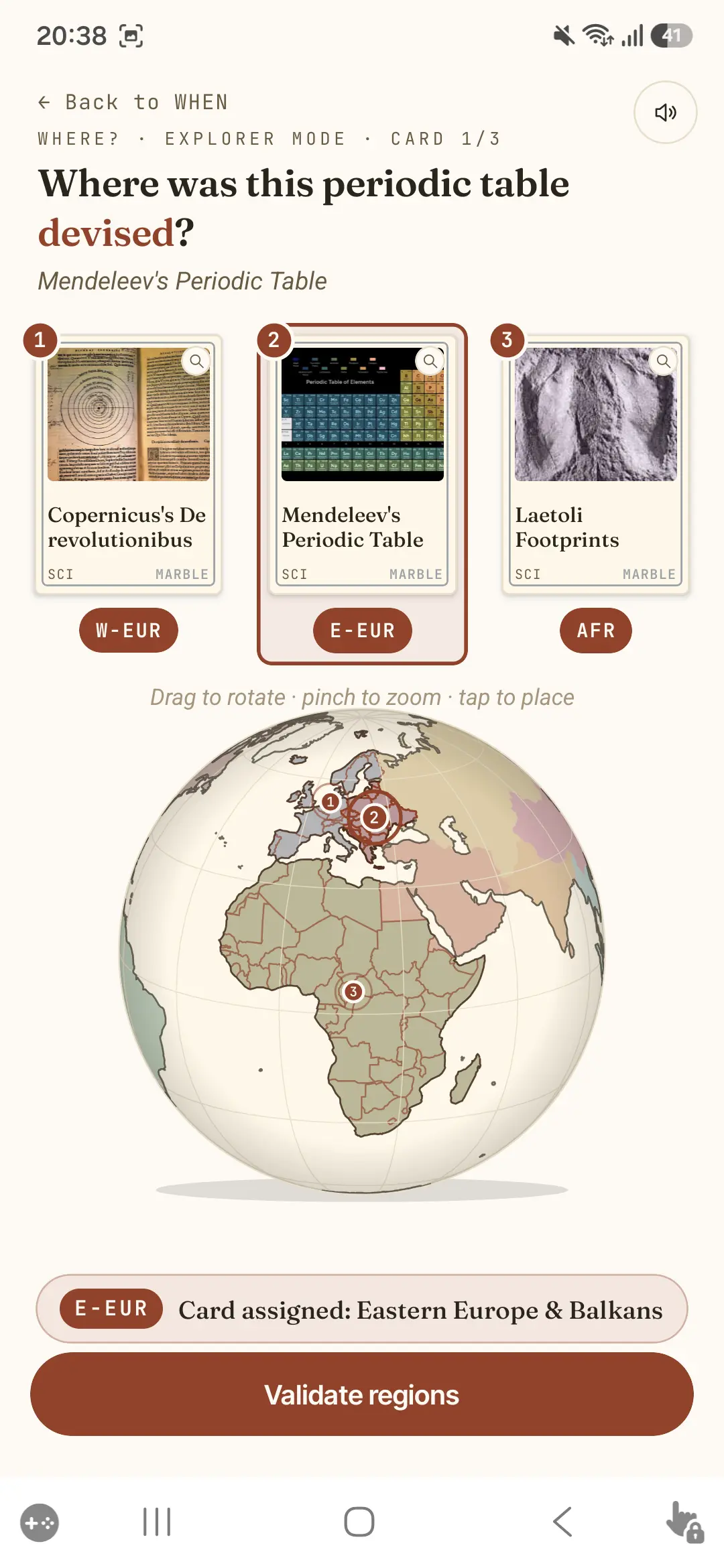Placing a card on the globe to answer “Where?”